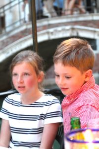 Luc and his cousin versed in ordering in Italian.