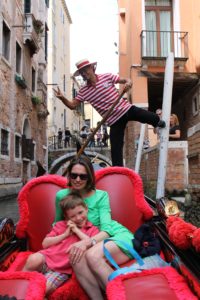 Chilling on the gondola ride and completely unaware of our gondolier hamming it up for the camera.