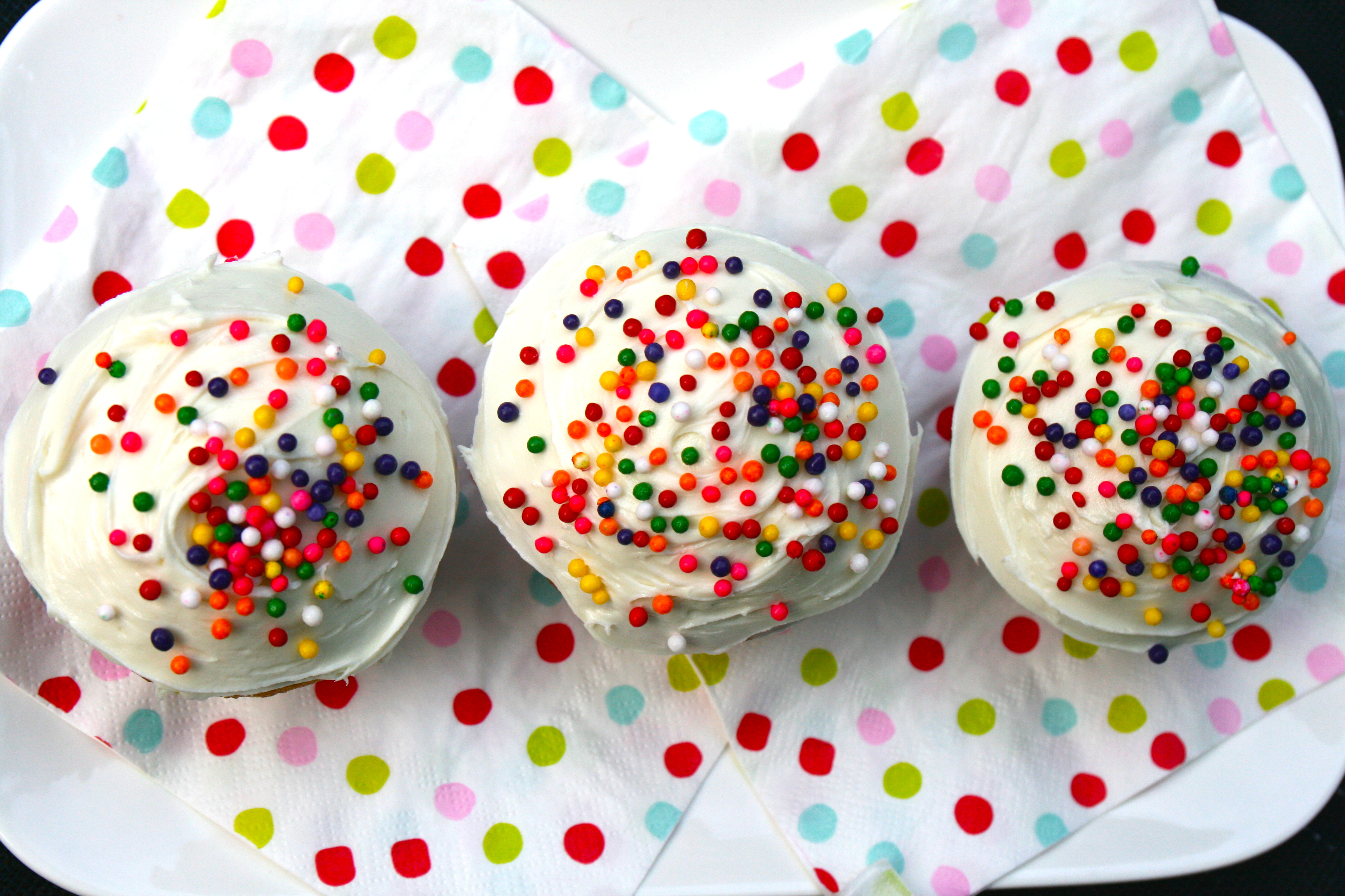 Sprinkled cupcakes to match the setting.