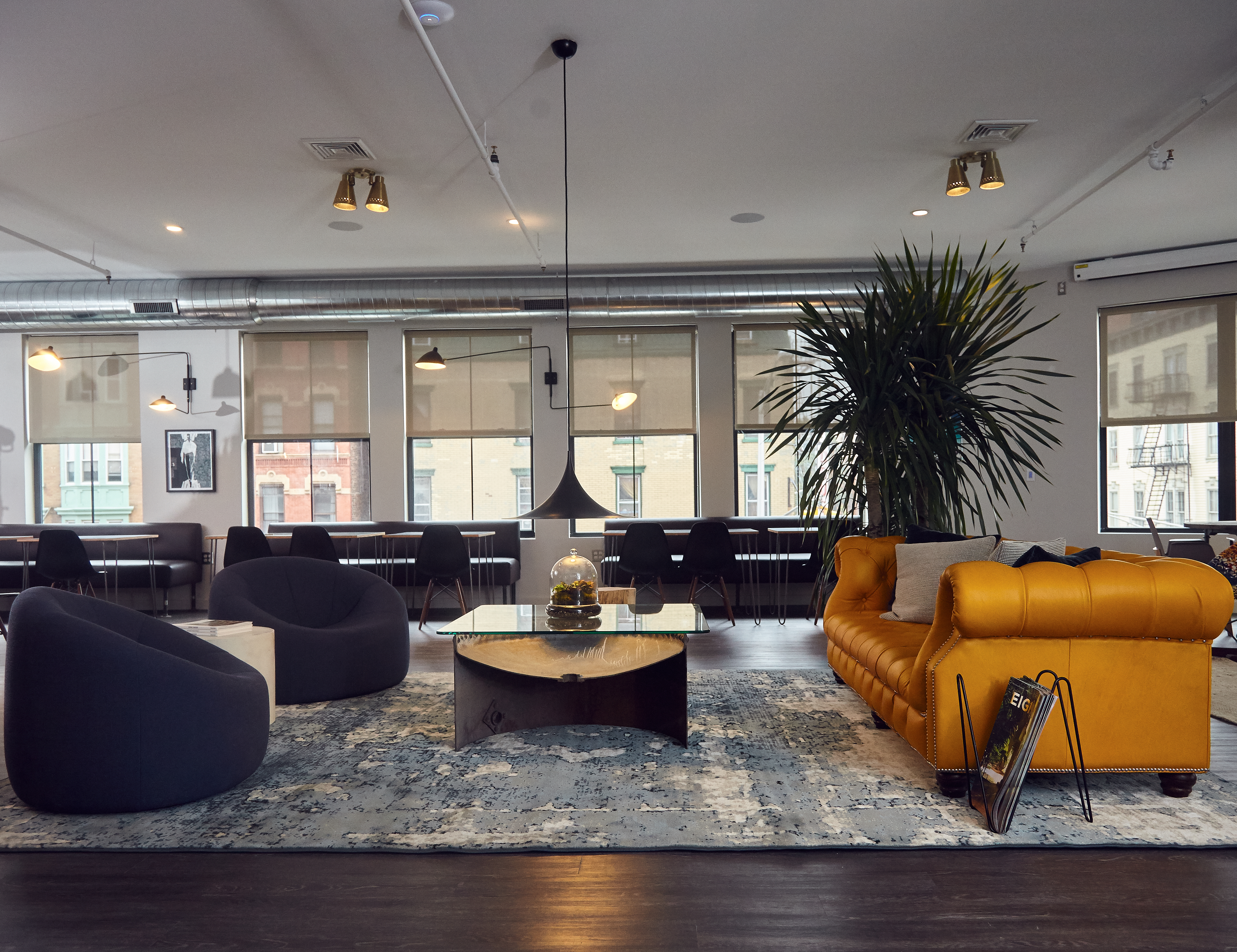 An attention to lighting creates a mood with a shared style of the space.