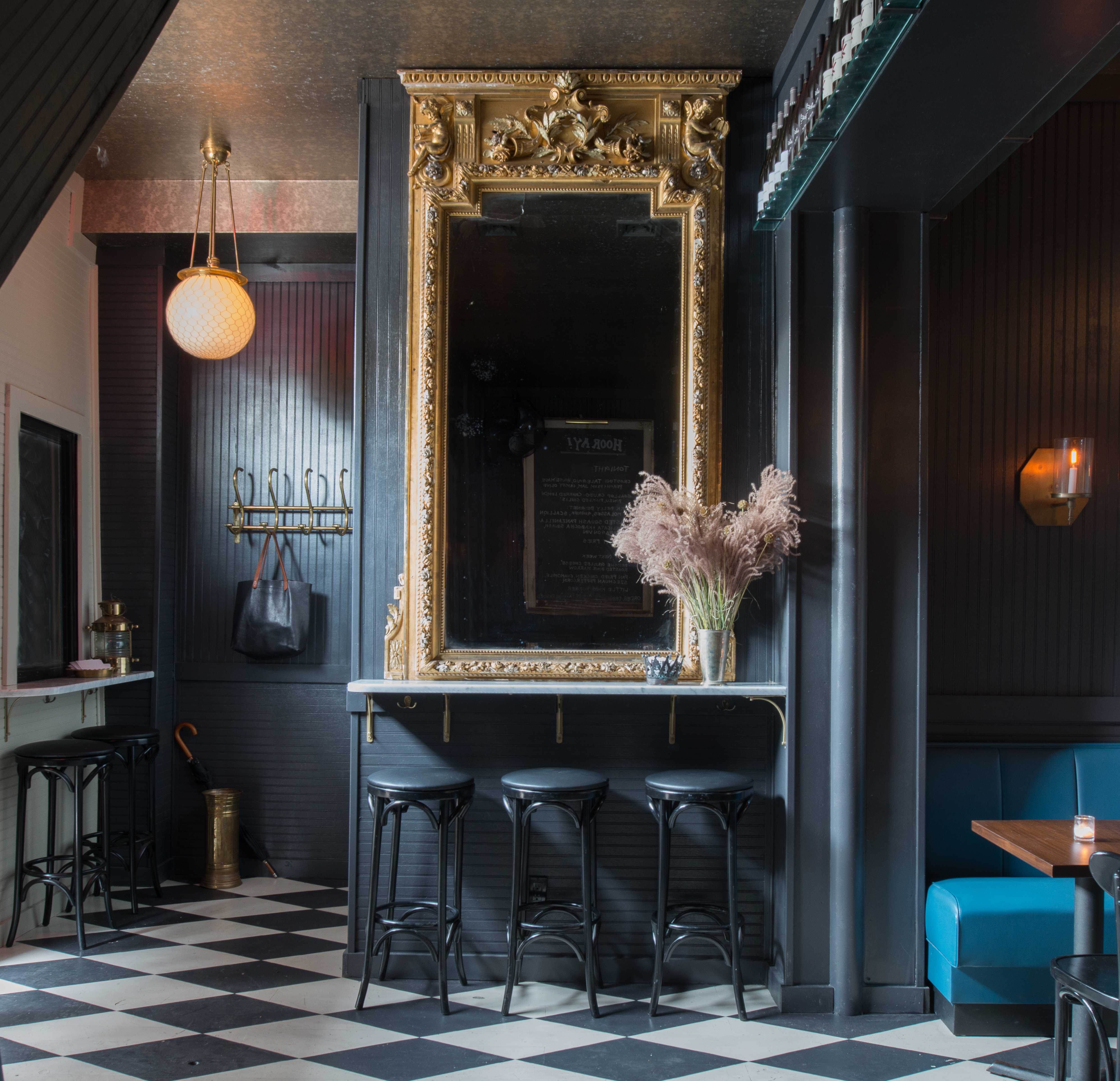 Hand-painted checkerboard floors play on the whimsical yet Old World theme.