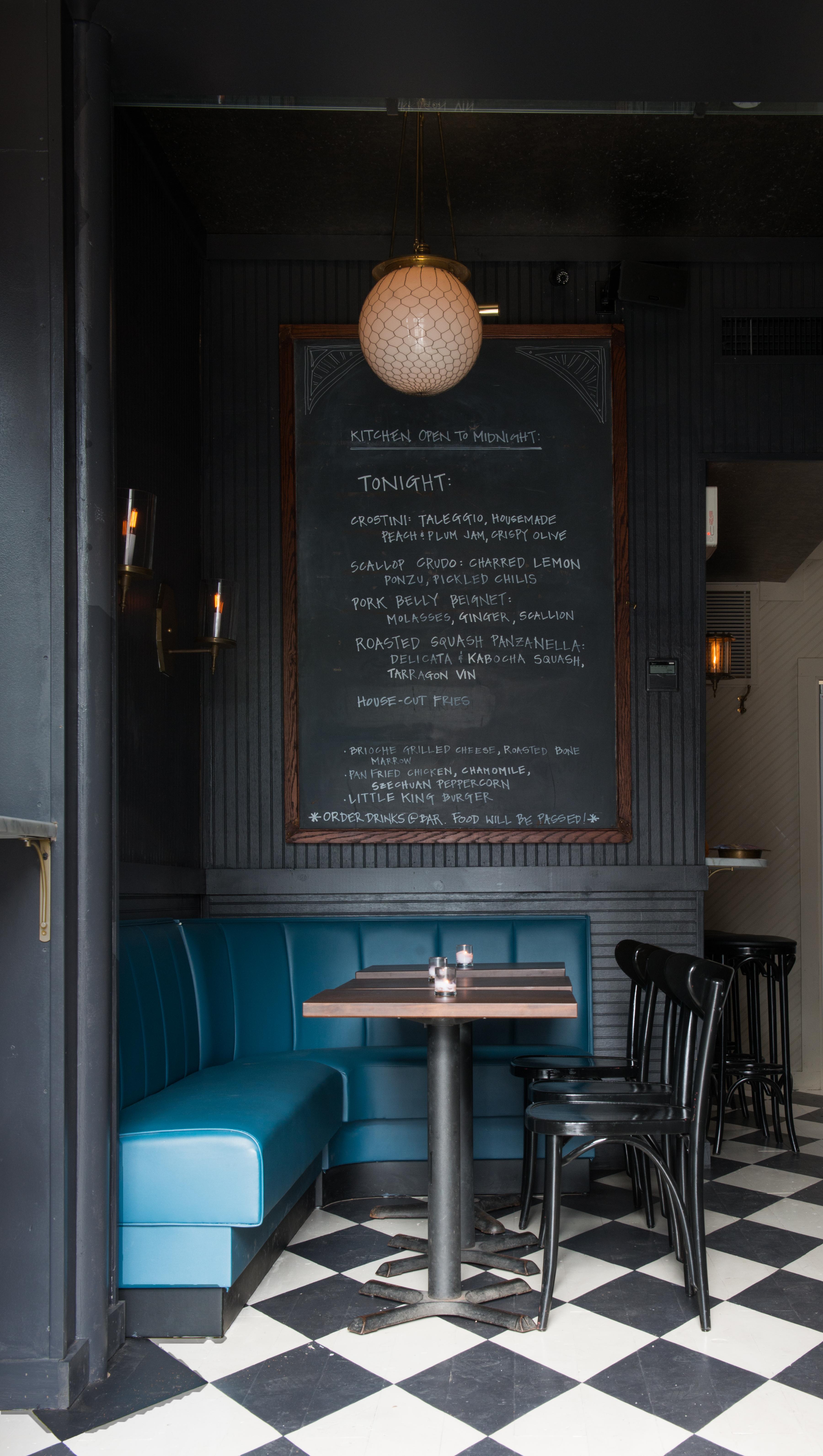 Neighborhood atmosphere achieved via a smoky color palette, touches of blue, and vintage details.