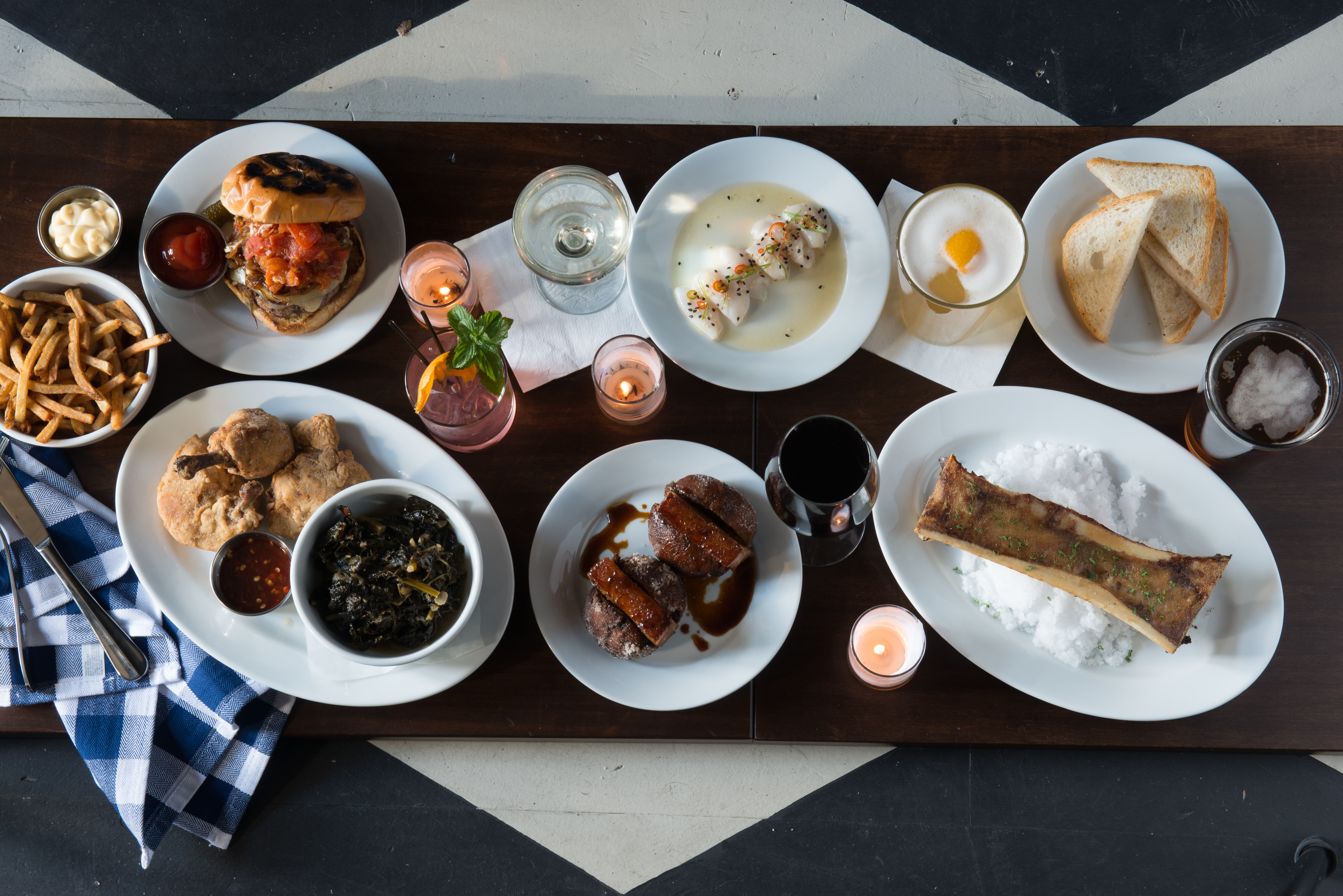 A delicious mix of pork belly beignets, scallop crudo and house cut fries with infused drinks.